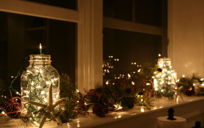 mason jar lights on window for christmas decor 