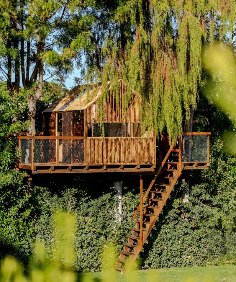 This Backyard Treehouse for Kids has Charred Wood Exteriors 