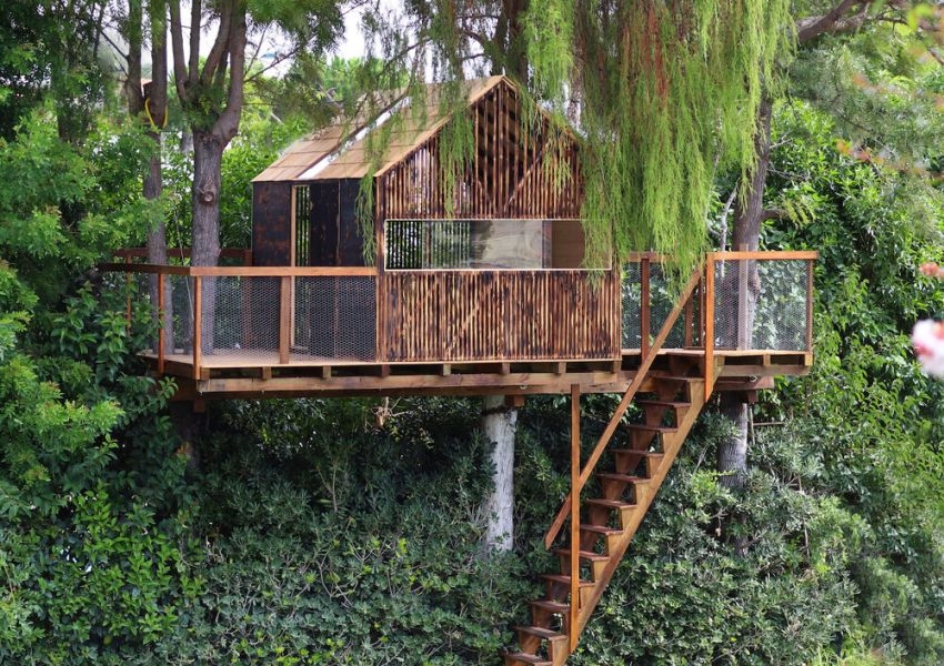 This Backyard Treehouse For Kids Has Charred Wood Exteriors