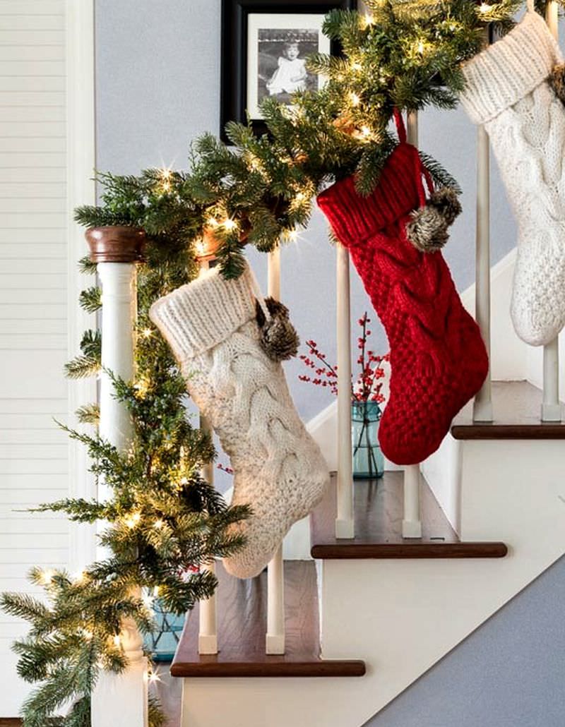 Red and white stockings tied to garland 