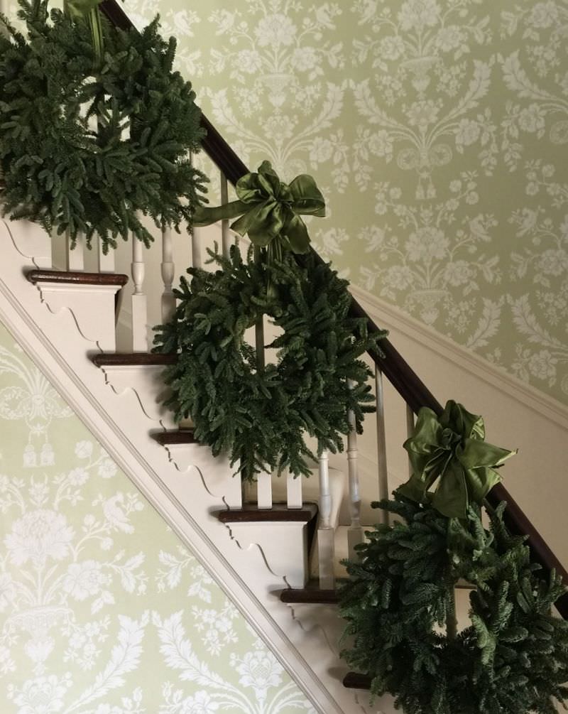 Wreaths hanging on staircase 
