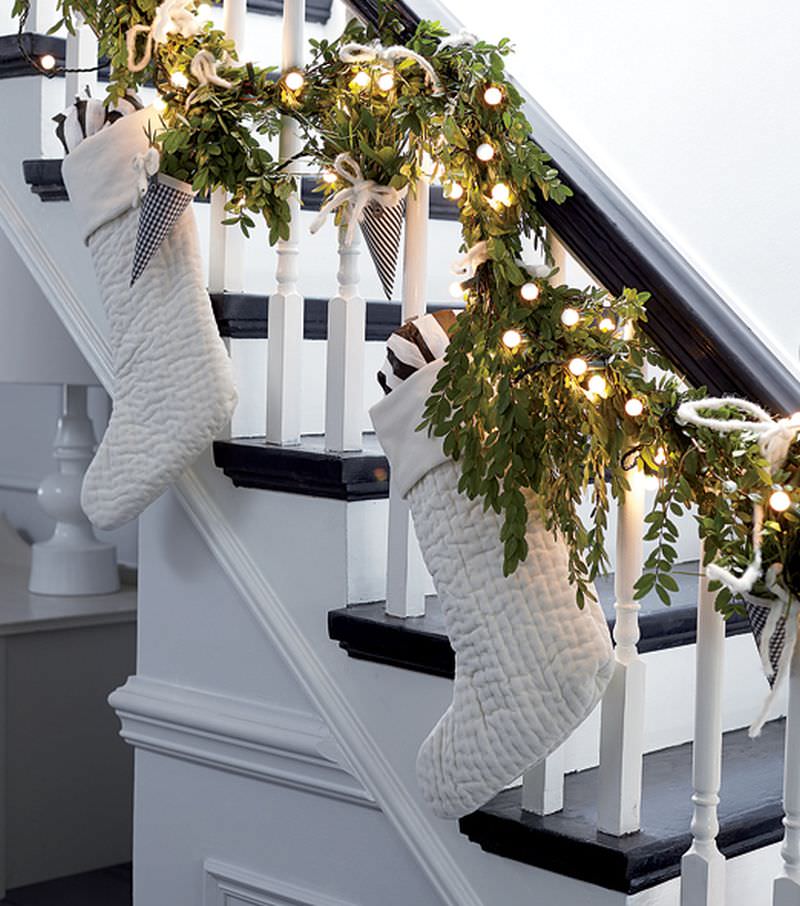 White stockings, lights and flower bouquets on staircase 