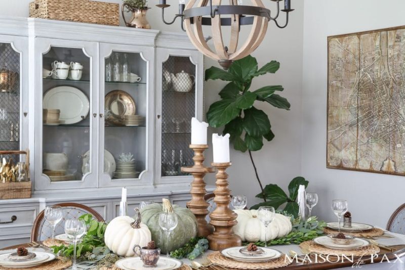 Neutral Thanksgiving Table decor with white pumpkins, mixed metallics, and greenery 