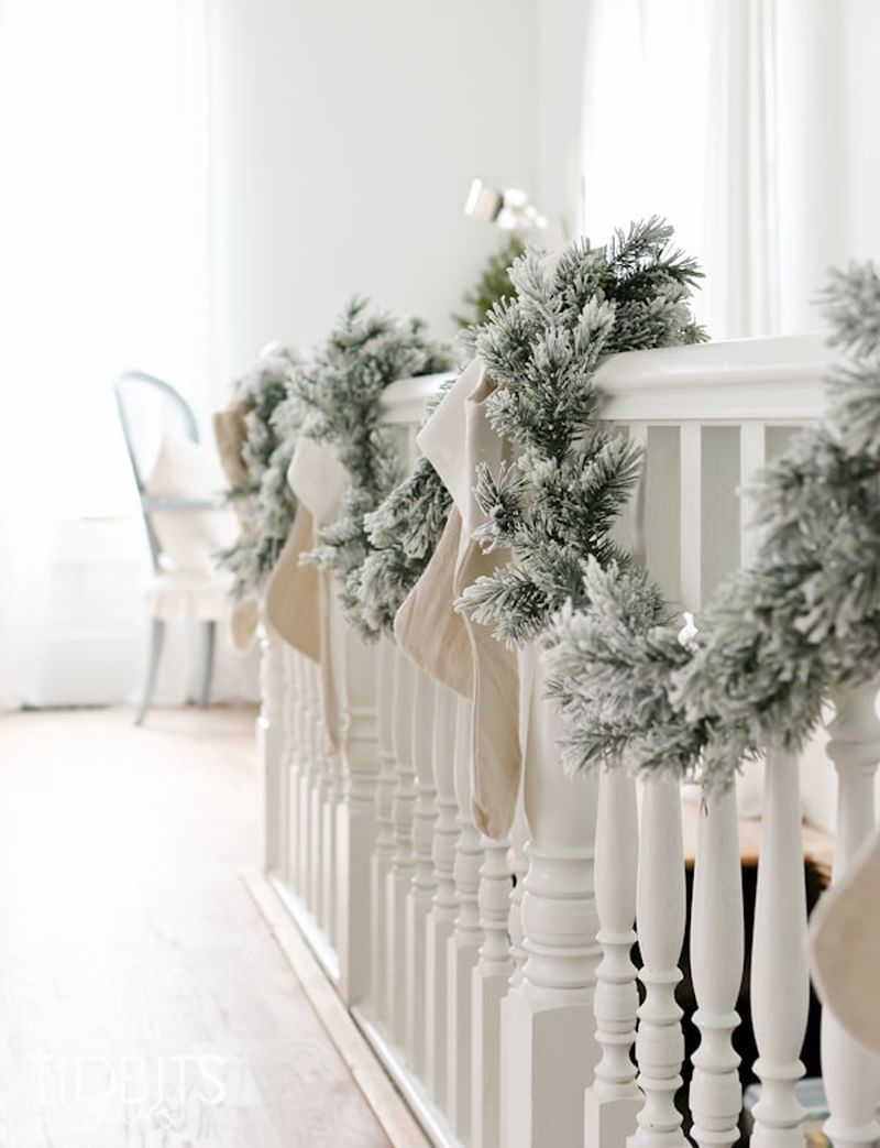 Snow flocked christmas staircase decoration idea