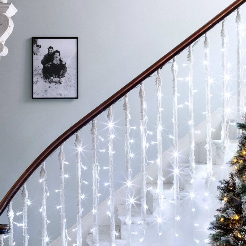 Light string draped on staircase 