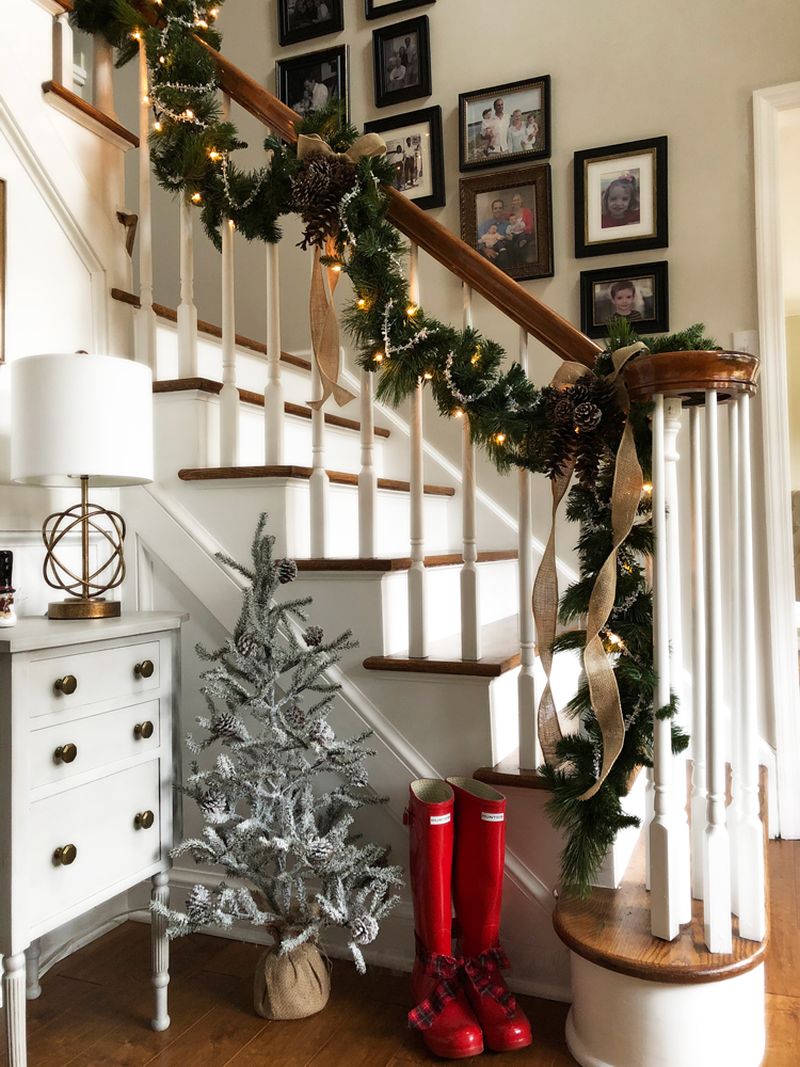 Green garland and burlap ribbon staircase decor for Christmas