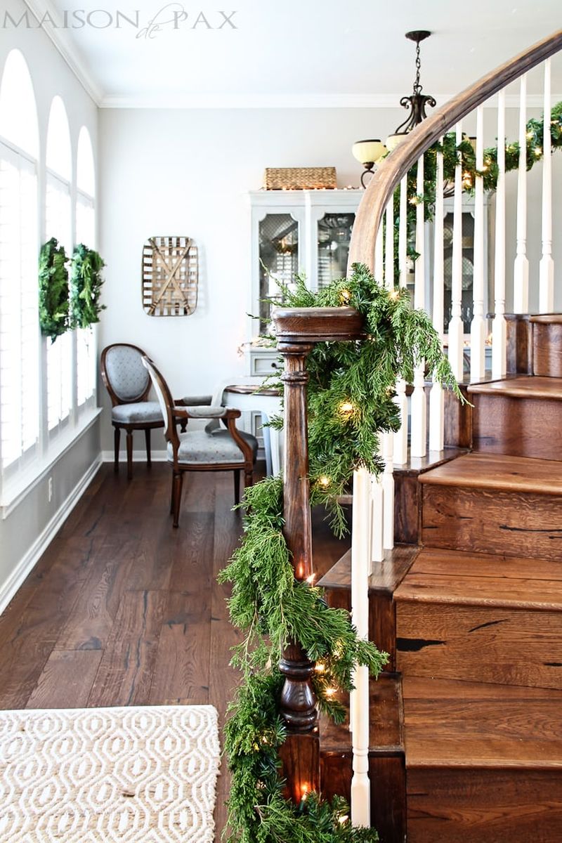 Christmas staircase decor with spruce garland 