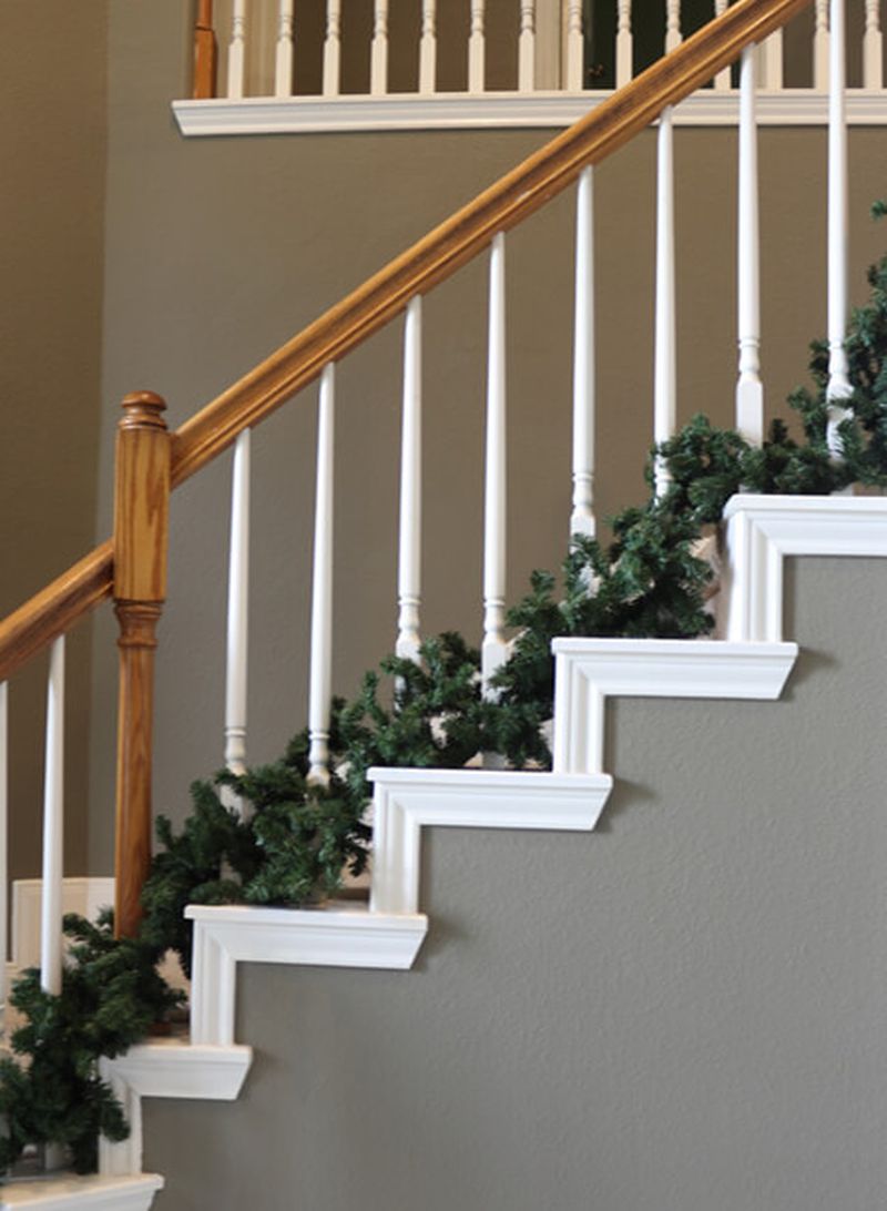 Staircase steps decorated with garland for christmas 