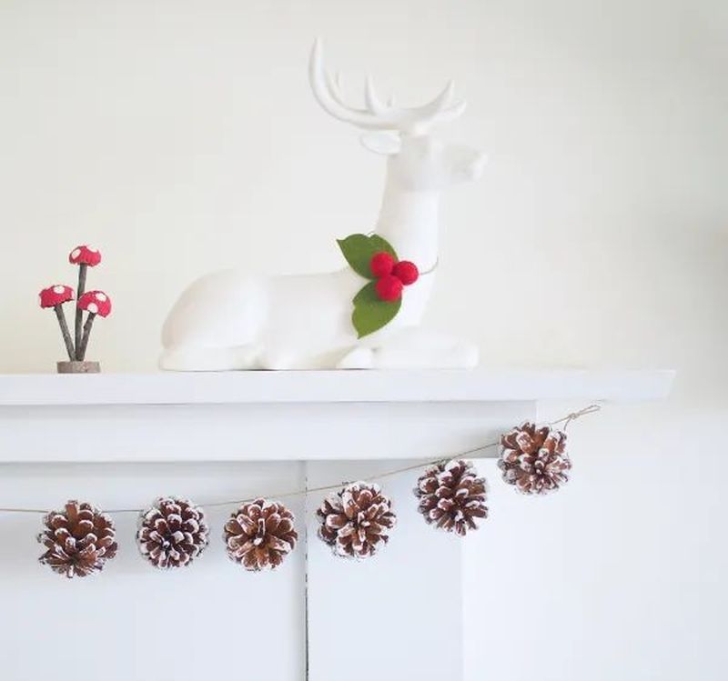 Pinecone Christmas Garland on fireplace mantel  