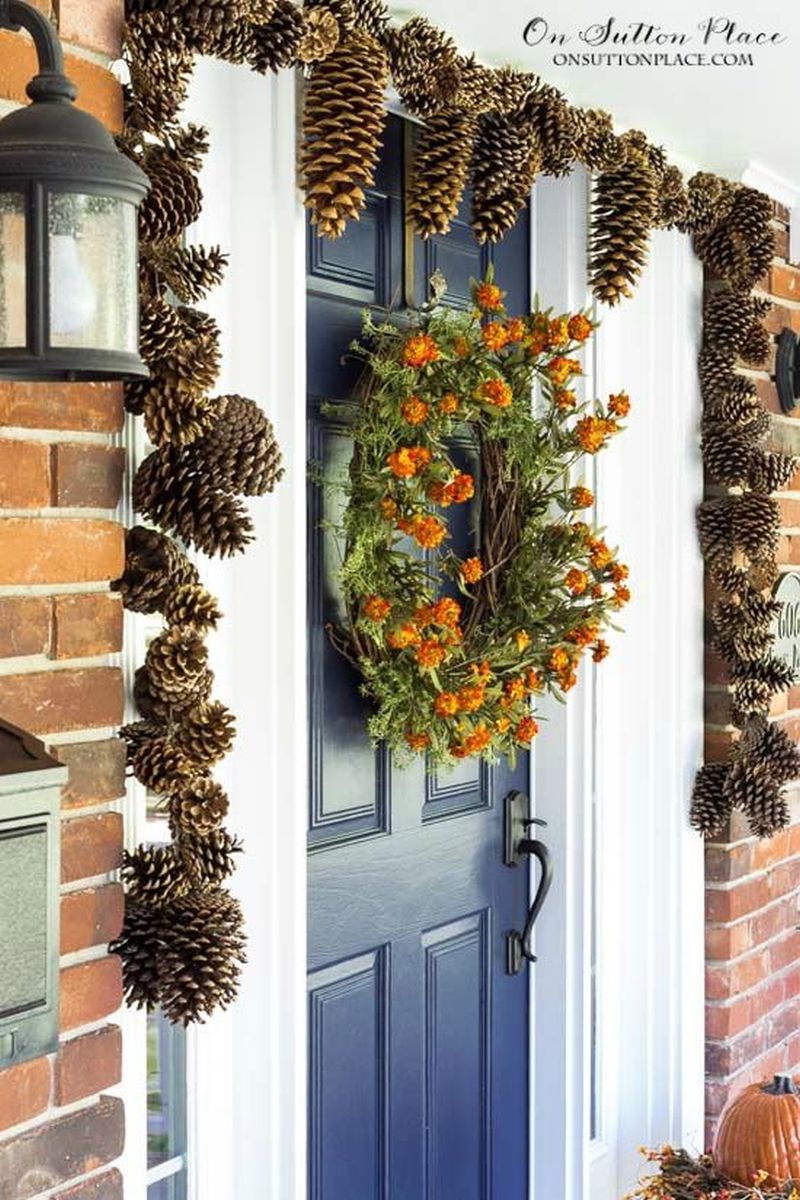 Christmas Garland made of Pinecones on front door 