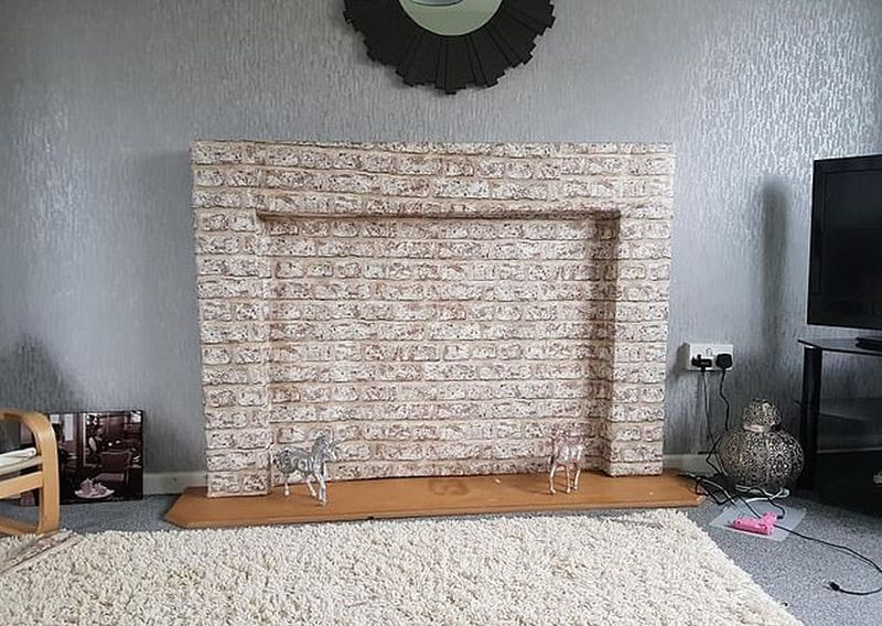 Mom Builds Temporary Fireplace Using Cardboard and Glue 
