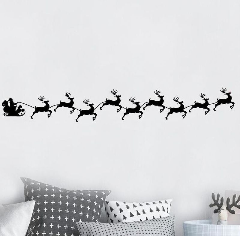 Santa's Sleigh with running reindeers Christmas wall decals in black 