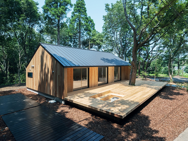 Muji’s Latest Prefab House Features Large Outdoor Deck with Sunken Seating & Fireplace