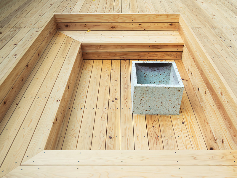 Muji’s Latest Prefab House Features Large Outdoor Deck with Sunken Seating & Fireplace